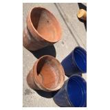 Two blue 11 inch tall plastic planters and two Two blue 11 inch tall plastic planters and two