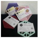 Four new packages of three count silicone trivet
