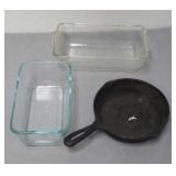 Pair of Pyrex bread pans with small cast iron pan Pair of Pyrex bread pans with small cast iron pan