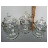 Three glass canisters with lids Three glass canisters with lids