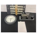 Wall clock, sign and hole punch