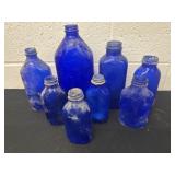 Group of vintage cobalt blue glass bottles