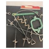 Group of stakes and scraper.