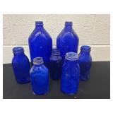 Group of vintage cobalt bottles