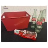 Red organizer with 3 coca cola glass bottle and