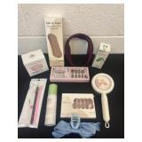 Group of new nails and hydration mist and a brush