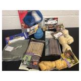 Group of dog toys, snacks, leash and bones