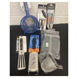 Group of new can opener, Garlic press, grater and