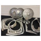 Group of vintage hub caps and grill light covers