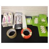 Group of tape, tall kitchen bags and show