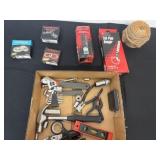 Group of tools and tail pipe hangers and more