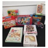 Group of puzzles, games, Legos and stego