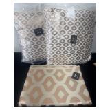 2 throw pillows and matching rug