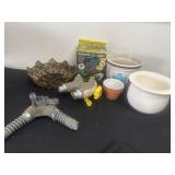 Group of planters and butterfly lights and hose