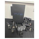 Ps2 game system with cords and controllers