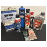 Group of garage items: propane, motor oil