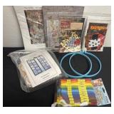 Group of embroidery thread and craft books