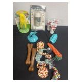 Group of new dog toys, bags and ointment