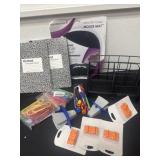 Group of office books, mouse pad and pens