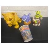 2 candy dispensers and lion king toy and cup