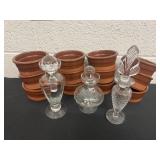 3 glass bottle with stopper and terra cotta