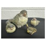 Family of ceramic bird figurines