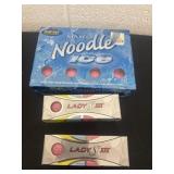 3 boxes of pink golf balls