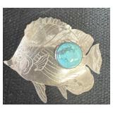 Sterling silver fish pin with turquoise stone