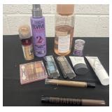 Group of make up and shampoo and serum.