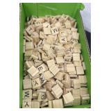 Box of scrabble letters.
