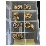 Group of auto trade mark emblems on chains (may