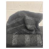 2 black silver tone rugs