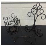 Group of metal plate stands and candle holder