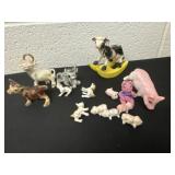 Group of cow and pig figurines