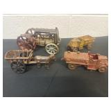 Cast iron fire trucks, horse and buggy and tractor