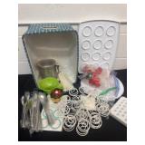 Group of kitchen items and flat ware and cup cake