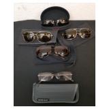 Four pairs of sunglasses and one pair of