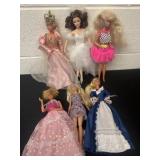 6 Barbie dolls