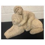 13ï¿½ dog and little Boy statue