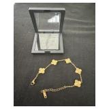 Gold Toned Clover Link Bracelet marked 18KGP