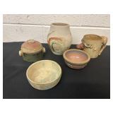Group or pottery vases  cups and bows
