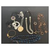 7 necklaces and a bracelet