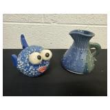 Clay pitcher with clay fish