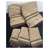 Group of new star brown towels and wash  clothes