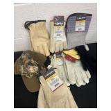 Group of new gloves and camo hat