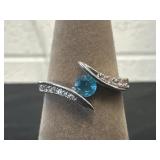 Silver ring with a blue topaz center stone Marked