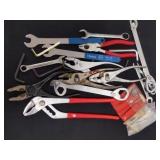 Group of tools including wrenches,