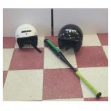 2 helmets and a bat
