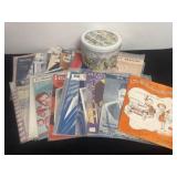 Group of vintage music sheets with Tin