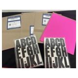 4 packs of hot pink paper and 2 packs of letters
